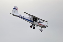 G-TROW, an Ikarus C42 microlight aircraft, in flight, based at Gloucestershire Airport